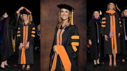 Nurse earning PhD and wearing robes