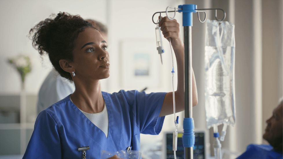nurse replacing IV bag in new jersey